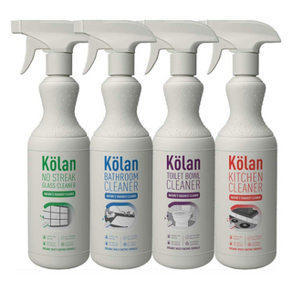 A set of four Kolan Organic Bathroom Cleaner spray bottles, labeled for different surfaces: bathroom, toilet bowl, glass, and kitchen. Each bottle is white with a label and a green spray nozzle.